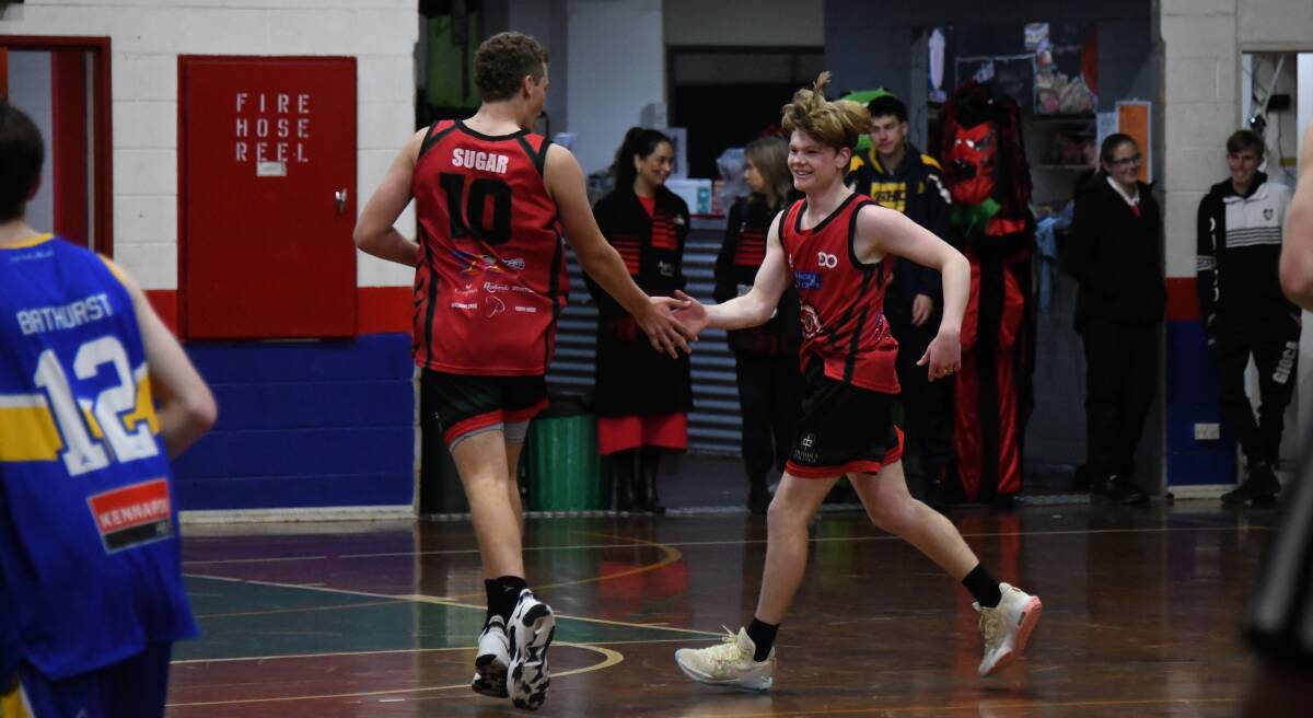 Kane McFarlane (left) and Will Emerton celebrate after a three-pointer. Picture by Nick Guthrie