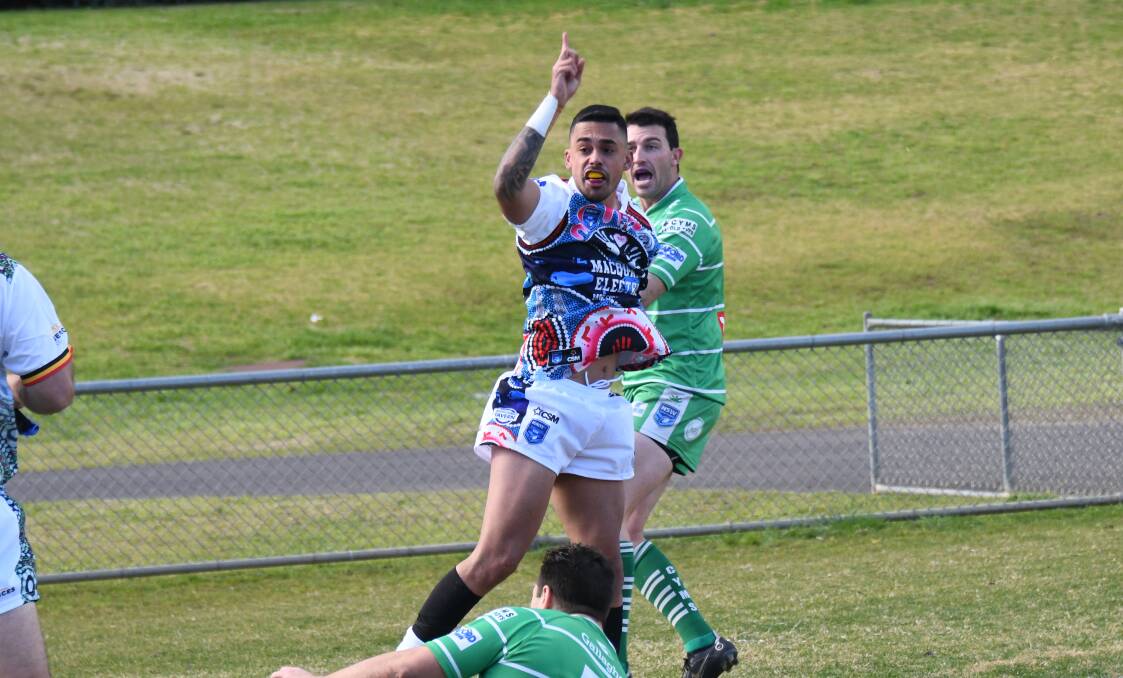 Clayton Daley celebrates a try in Macquarie's 2022 Indigenous jersey. Picture by Amy McIntyre