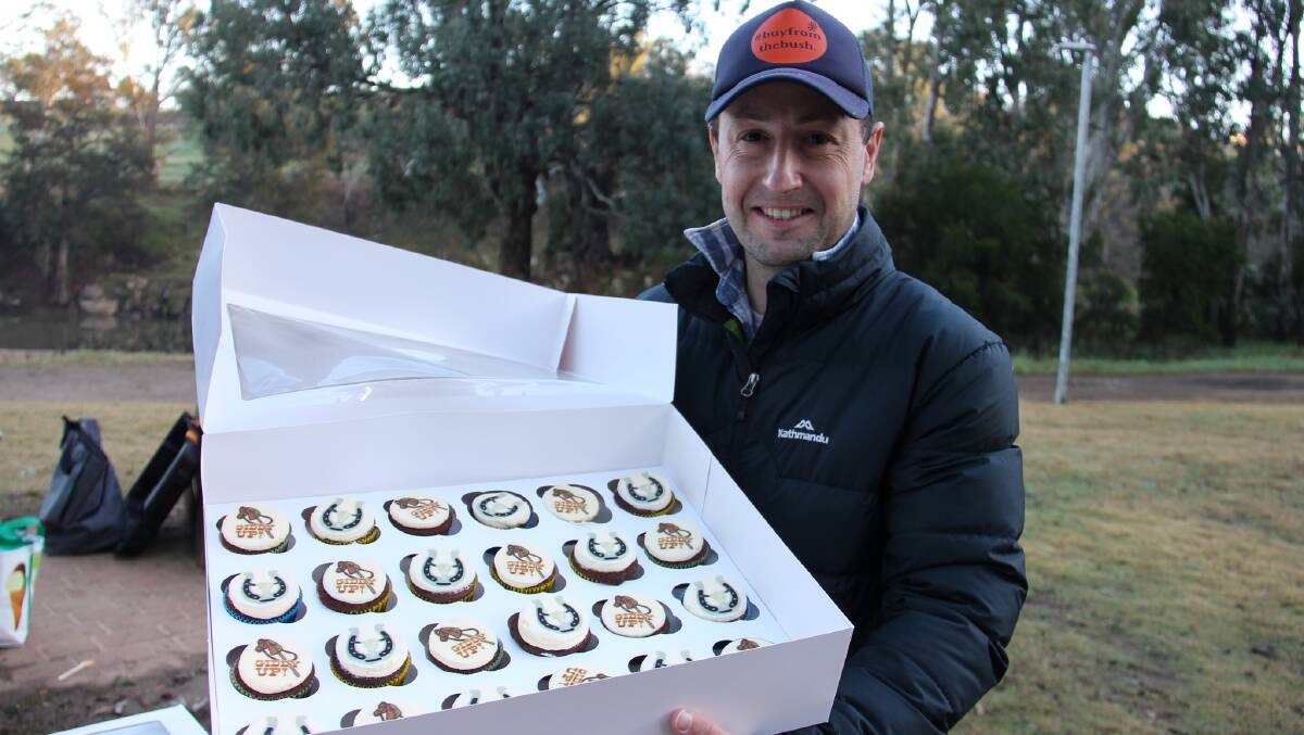 Dubbo park run's Tim Morris celebrates with cupcakes on Saturday at the eighth birthday of the event. Picture supplied