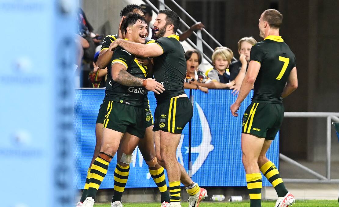 Kotoni Staggs celebrating scoring on debut for Australia. Picture by Ian Hitchcock/Getty Images
