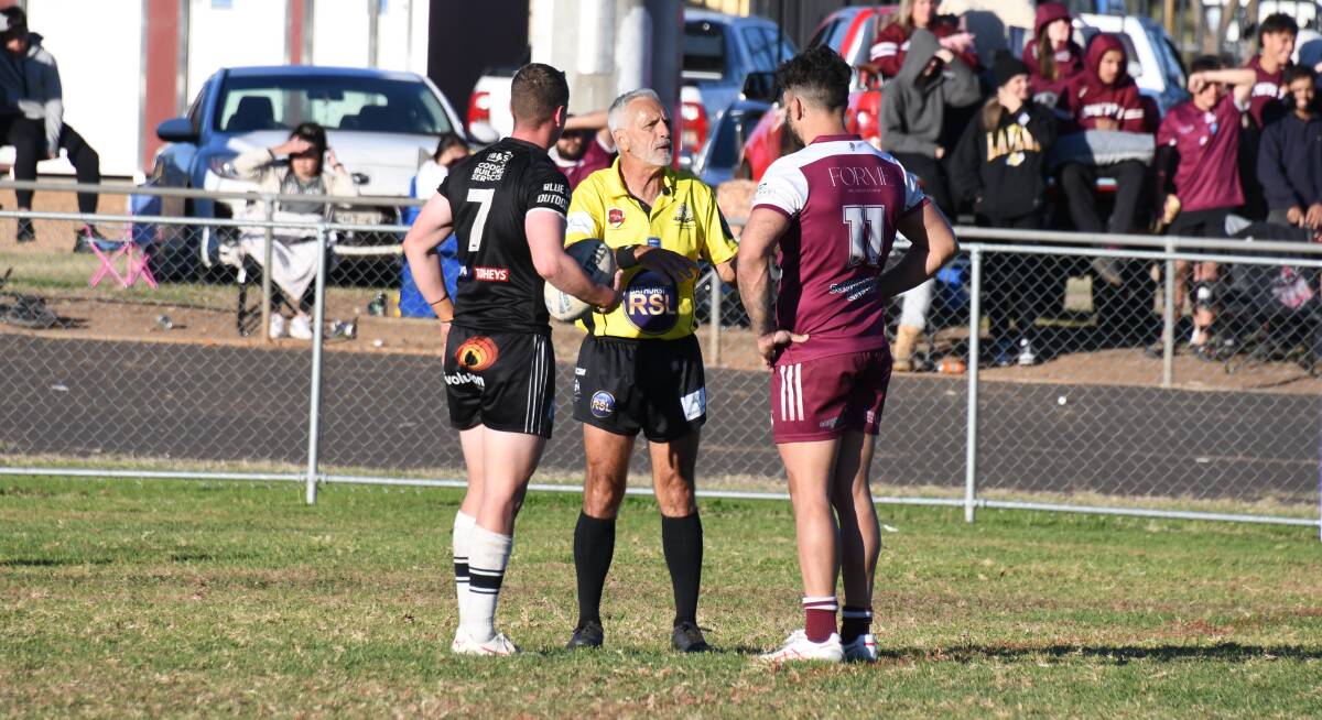 Referee Willy Barnes speaks with Forbes' Nick Greenhalgh (left) and Justin Toomey-White from Wellington (right). Picture by Nick Guthrie 