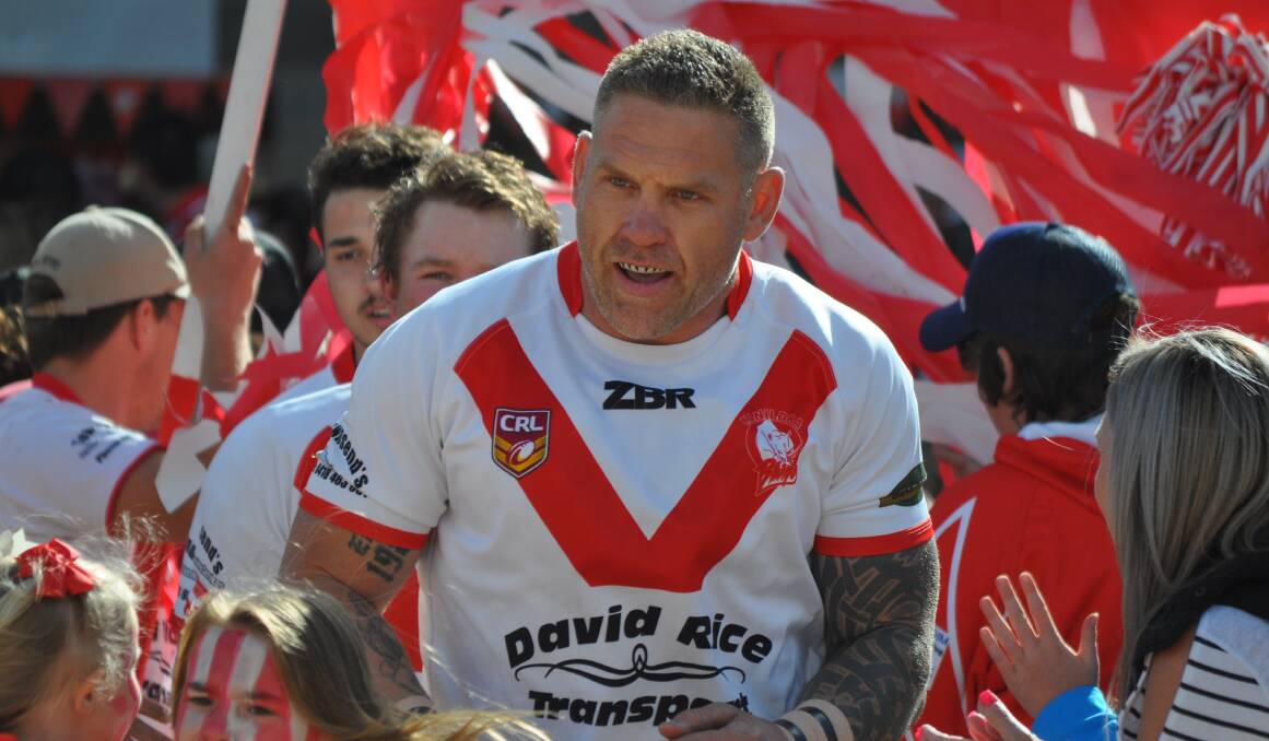 Manildra Rhinos coach Simon Osborne leads the team out for the 2018 Woodbridge Cup grand final. Picture by Nick McGrath