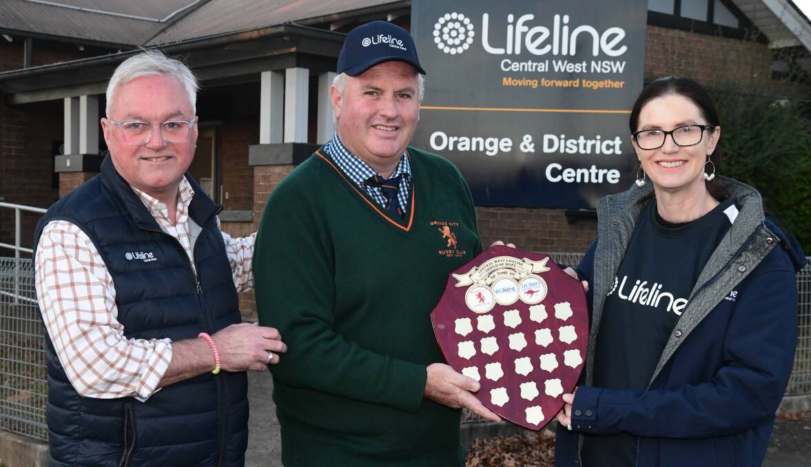 Tom Donaghy, Darren Wooding, Jane Poole hold the Lifeline Shield of Hope. Picture by Carla Freedman