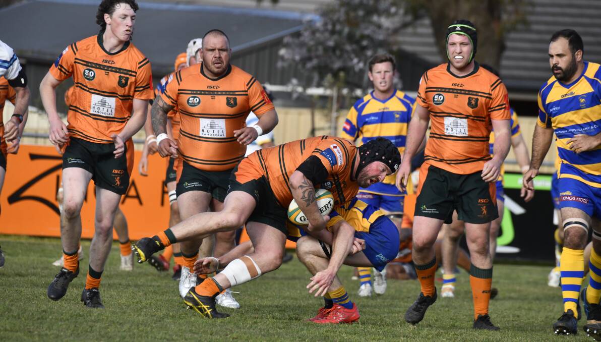 Orange City's Josh Tremain carries the ball forward against Bathurst Bulldogs. Picture by Jude Keogh