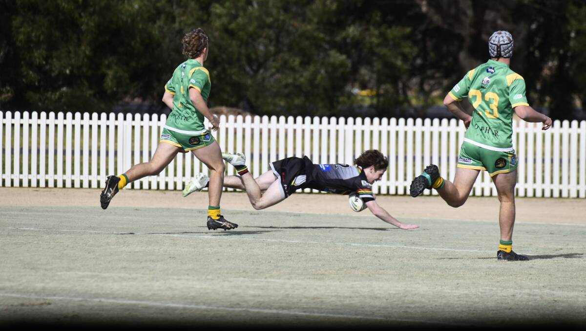 Haydn Edwards goes over against Orange CYMS. Picture by Jude Keogh
