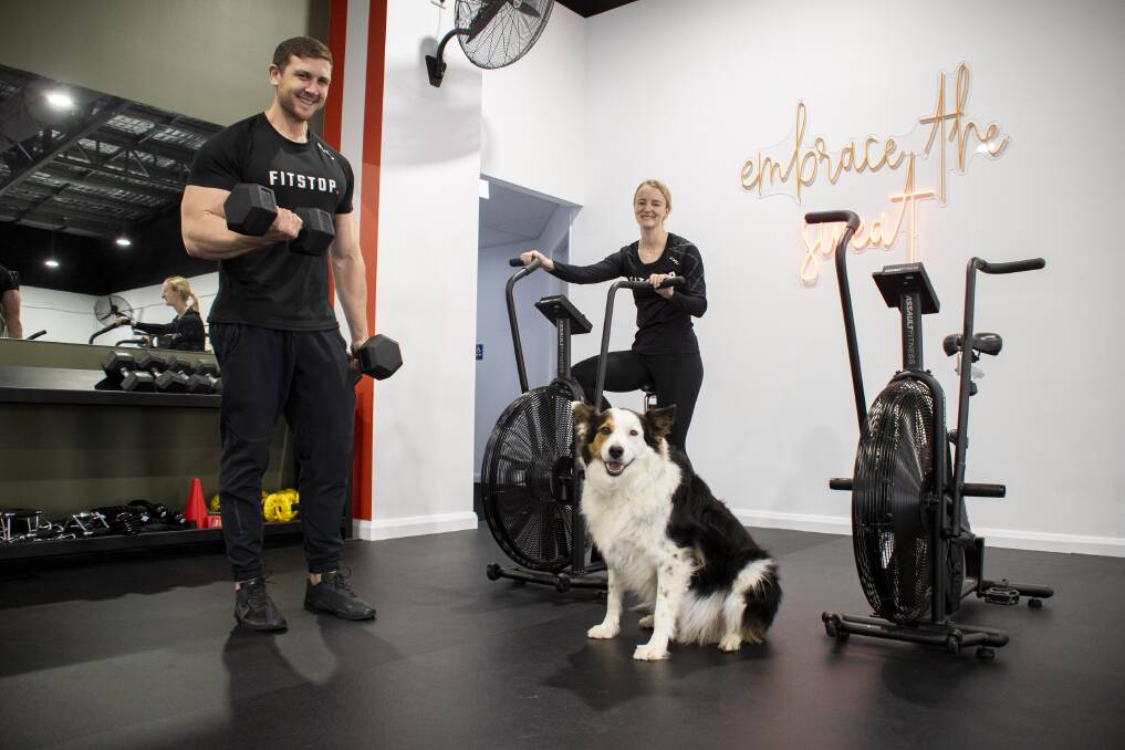 FitStop owners Rachel Ferdinand and Craig Anderson with Parker. Picture: Belinda Soole