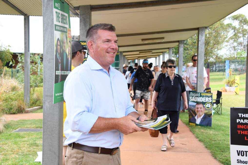 Dubbo Nationals candidate Dugald Saunders hands out 'how to votes' on election day. Picture by Amy McIntyre