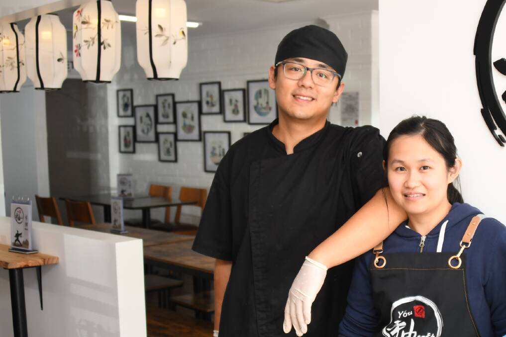 You Cafe owners David Shi and Belle Wong in their popular Brisbane Street cafe. Picture by Amy McIntyre