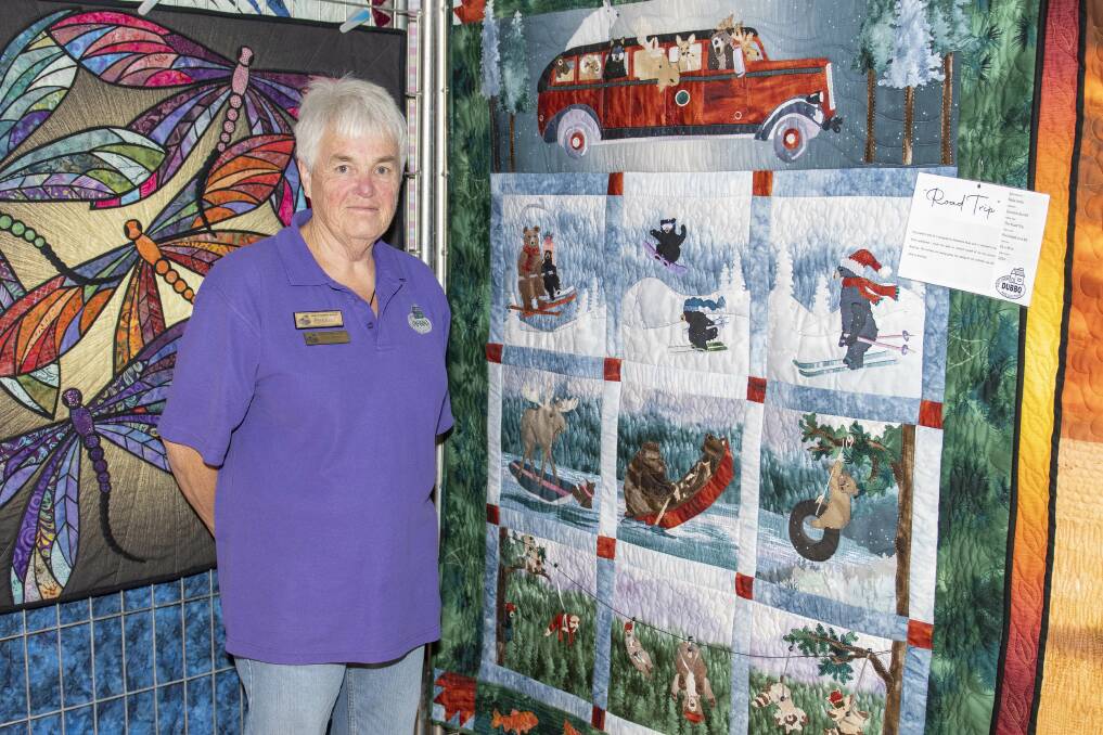Dubbo Patchwork and Quilters group president Nola Jones with her quilt 'Road Trip'. Picture by Belinda Soole
