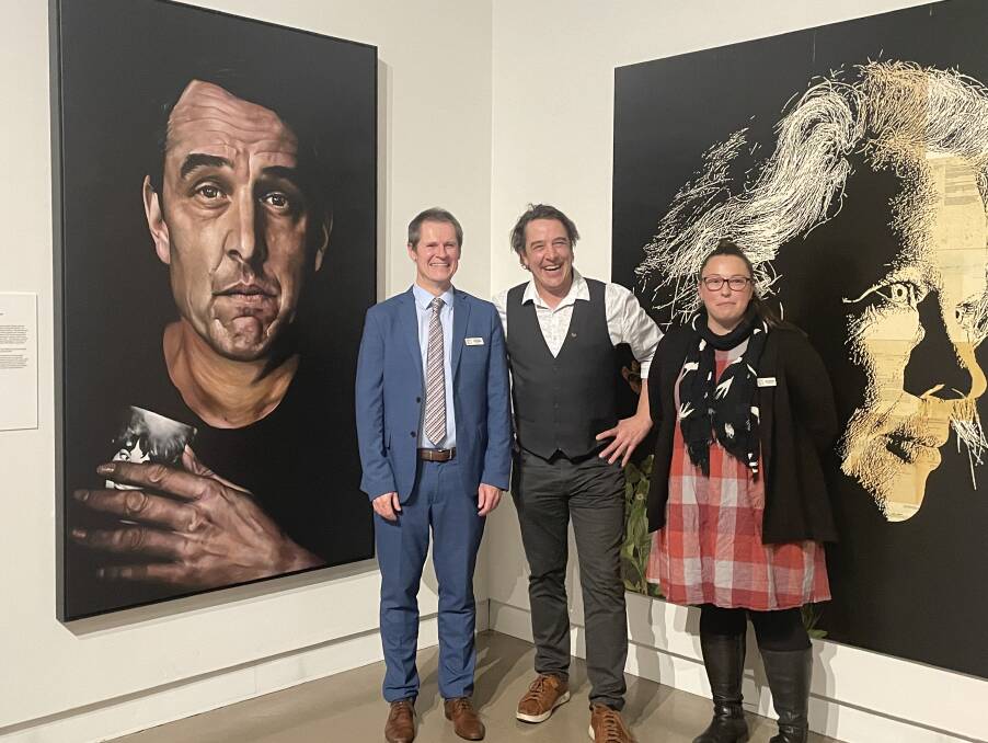 Samuel Johnson (centre) with mayor Mathew Dickerson and councillor Jess Gough at the Archibald Prize exhibition at the Western Plains Cultural Centre. Picture by Allison Hore