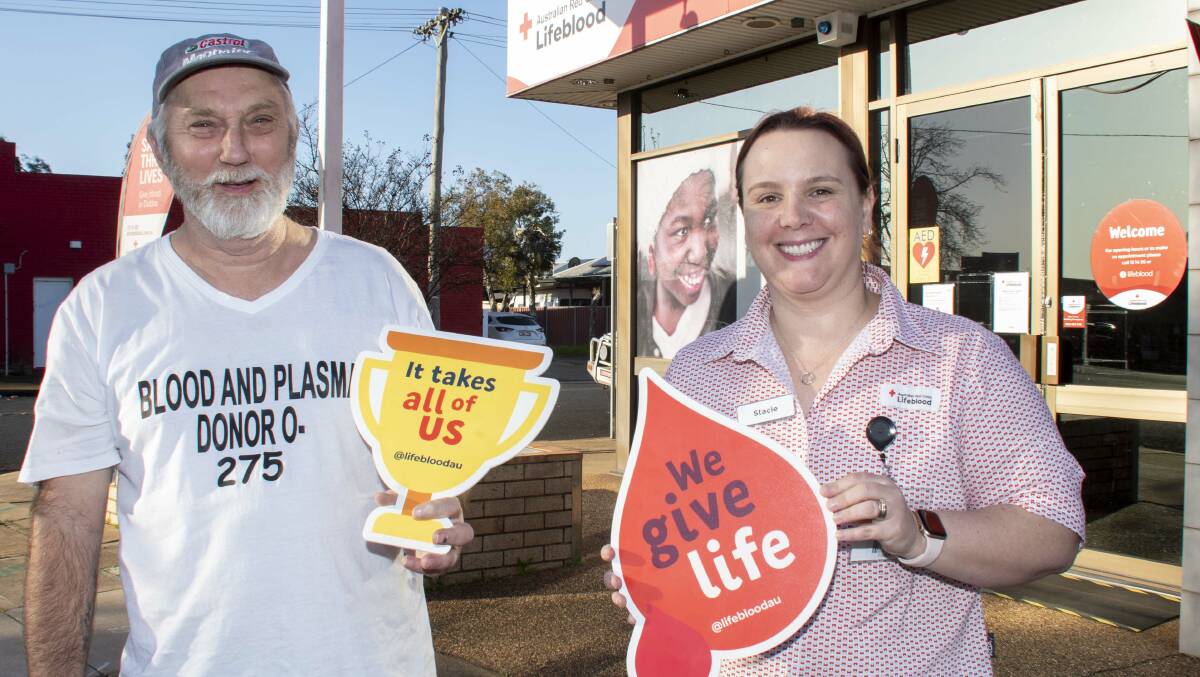 Kerry Felstead with a staff member at the Dubbo blood donation centre celebrating his 275th donation. Picture by Belinda Soole