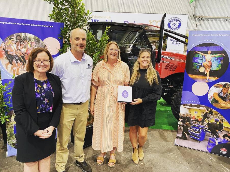 Raechel McCarthy (Relieving Executive Director, Regional, Rural and Remote Education) and Duncan Kendall (Head of Education, Royal Agricultural Society of NSW) with Skye Dedman and Bek Coddington from Hermidale Public School. Picture supplied