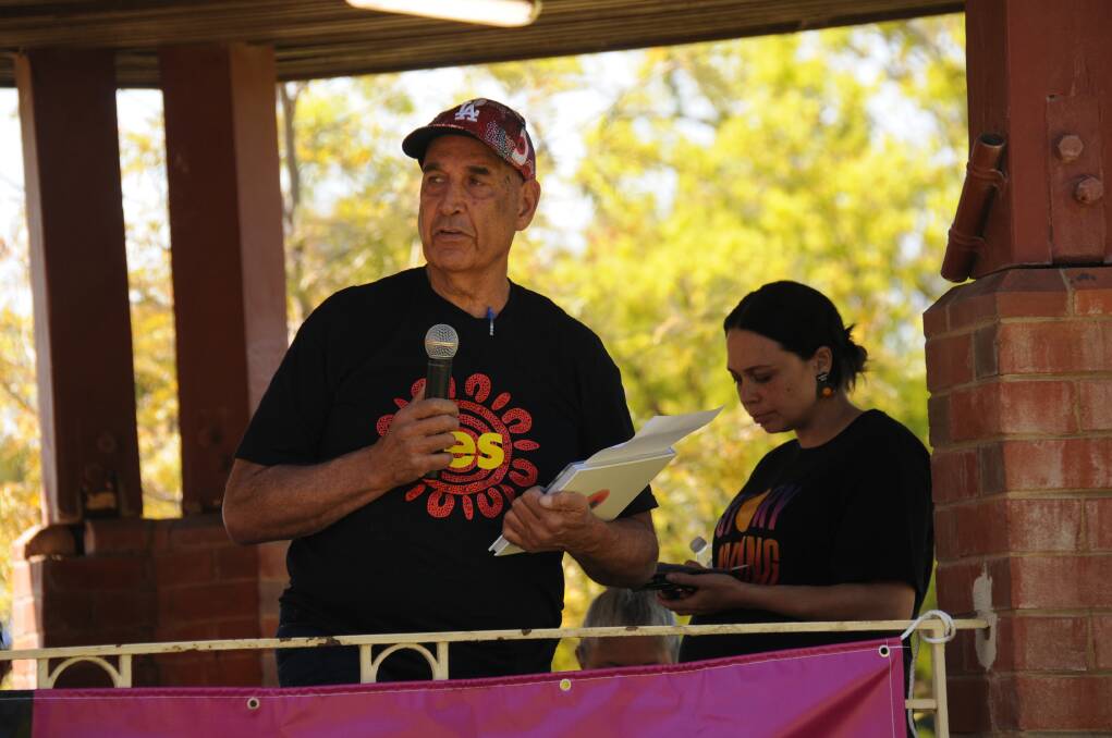 Rod Towney showed the crowd the signed Uluru Statement From the Heart. Picture by Allison Hore