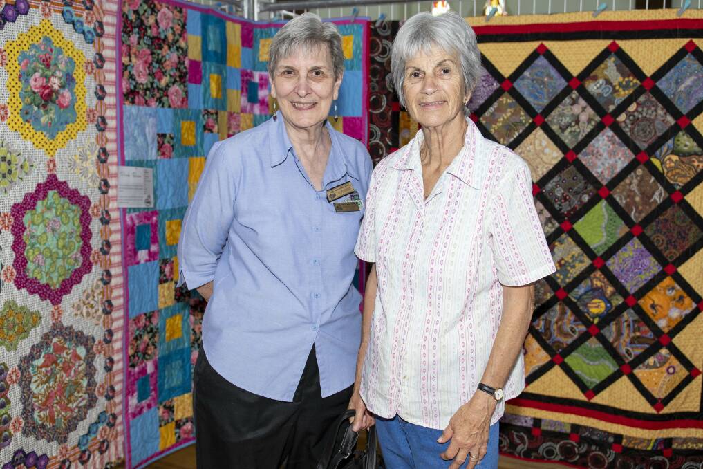 Charlene Bower and Brenda Lake at the exhibition with their quilts. Picture by Belinda Soole