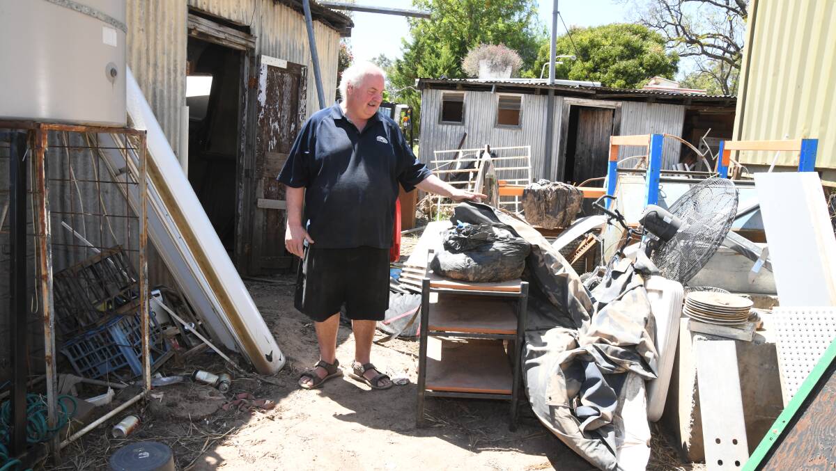 Daniel Townsend at the rear of his store, where he also used to live, still debris-ridden on October 25. Picture by Jude Keogh.