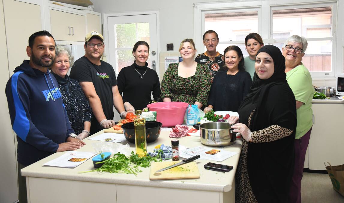 From right, scientist and teacher Salam Farachi Taleb,at the Multicultural Cooking Class at the CWA Building's kitchen at 83 Wingewarra Street with Lorraine Manusu, Peta Couvret, Amelia Cameron, Wayne Parish, Ruby Thompson, Kim Howard, Tristan Cameron, Amanda Mackay and Connecting Community Services migrant support officer Khaled Taleb. Picture by Amy McIntyre 