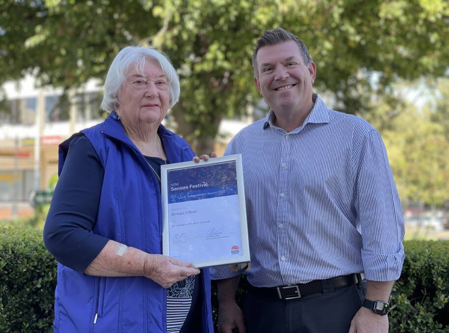 Barbara O'Brien received the NSW 2022 Seniors Festival Local Achievement Award for the Dubbo-Orana region from Dubbo MP Dugald Saunders. Picture Supplied