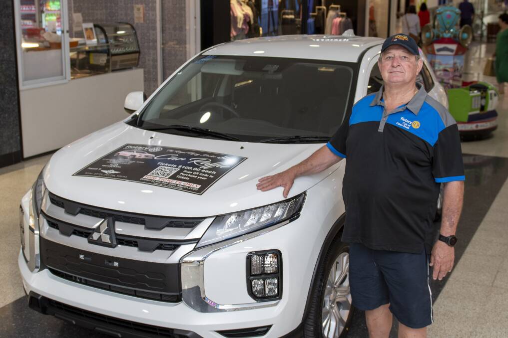 Rotary Club Dubbo South member David Lomax showing the brand-new Mitsubishi model valued at $35,000 donated by Western Plains Mitsubishi to raise funds for the Royal Flying Doctor Service. Picture by Belinda Soole