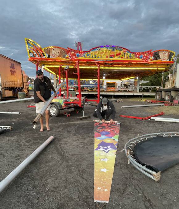 A truck waits to take Spiderman Bungee and its owner Gage Baker (left) to the Brisbane Show. PICTURE: ELIZABETH FRIAS