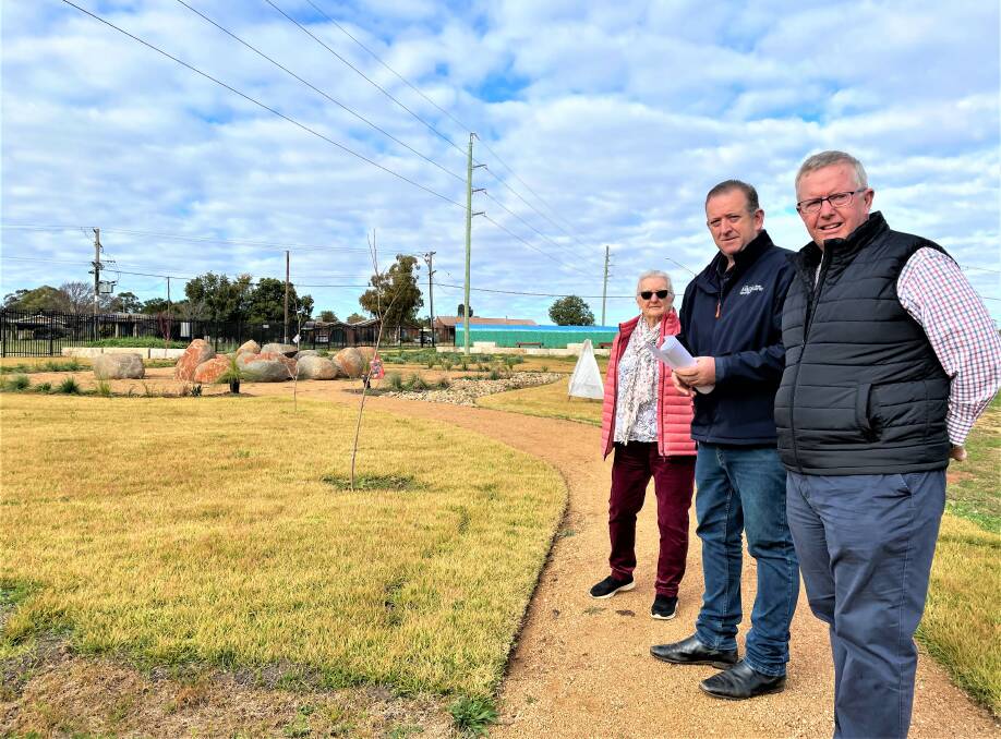 Macquarie Home Stay director Rod Crowfoot (middle) and volunteer Susie Hill showing Parkes MP Mark Coulton in July 2022 a part of the property they can build an extra 16-room facility next to the MHS Queen Elizabeth Jubilee Garden funded by the federal government. Picture by Elizabeth Frias
