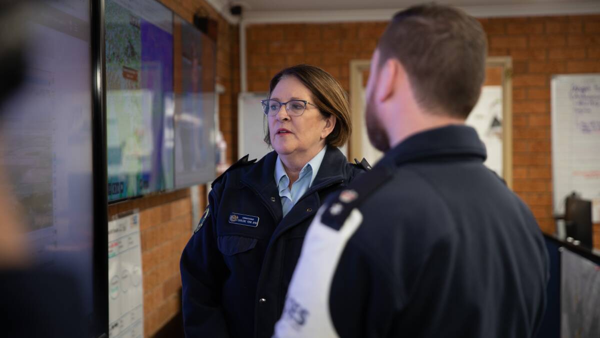 NSW SES Commissioner Carlene York is briefed by southern zone incident controller Shane Hargrave at Wagga headquarters. Picture by Madeline Begley