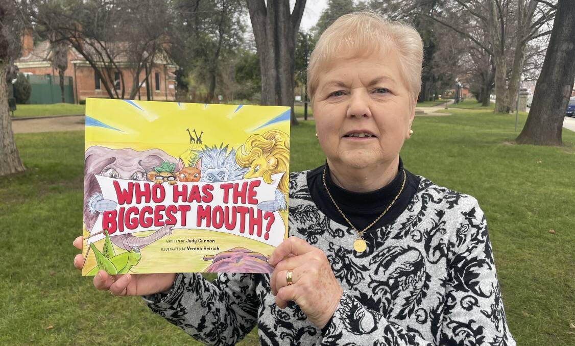 Bathurst woman Judy Cannon with a copy of her new book Who Has The Biggest Mouth? Picture by Bradley Jurd
