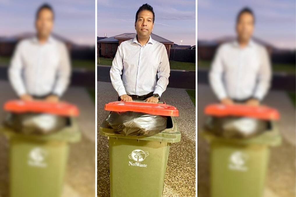 Councillor Shibli Chowdhury with his overflowing small red garbage bin. Picture supplied 
