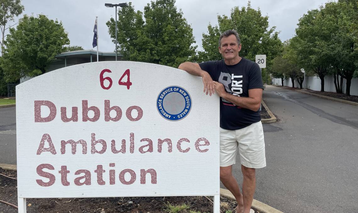 Peter Daly leaning on the sign outside the Dubbo Ambulance Station. Picture by Ciara Bastow 