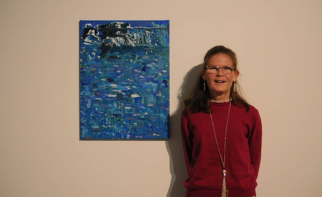 Kate Kenworthy standing with one of her artworks. Picture by Ciara Bastow 