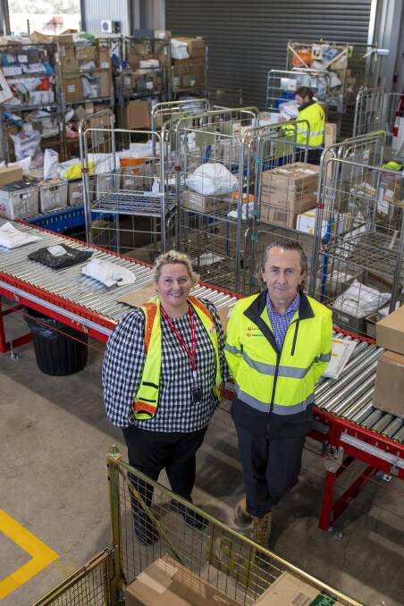 Kristina Jorgenson Regional Area Manager with John Bold Territory West Manager at the new Australia Post parcel centre in Dubbo. Picture by Belinda Soole