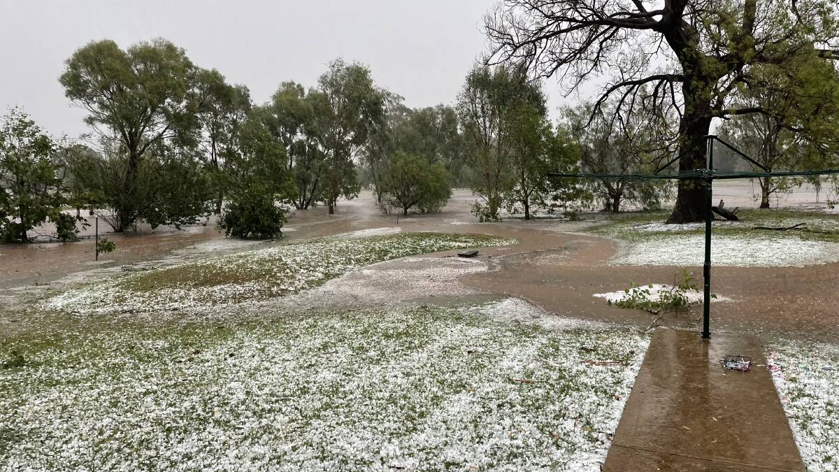 Hail and a flooded backyard during last Thursday's storm. Picture by Tom Barber