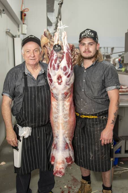 David Sharkey and Kaidyn Mohr at Bourke Street Butchery, Dubbo, with a whole goat from The Gourmet Goat Lady at Collie. Picture by Belinda Soole