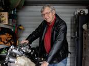 Peter Wright with engine parts - one of his interests - in his Dubbo garage. Picture supplied