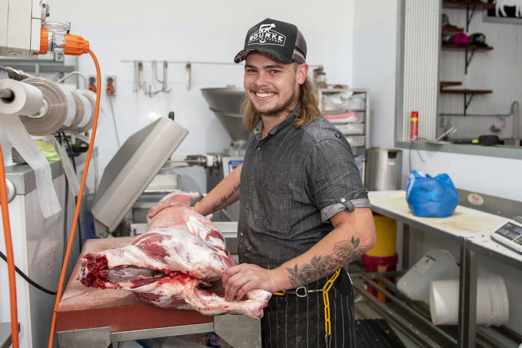 Kaidyn Mohr from Bourke Street Butchery, Dubbo, prepares a goat from The Gourmet Goat Lady at Collie. Picture by Belinda Soole