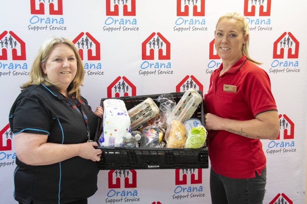 Maryanne Bonney of Orana Support Services with Sarah Dougherty, manager Coles Dubbo. Picture Belinda Soole