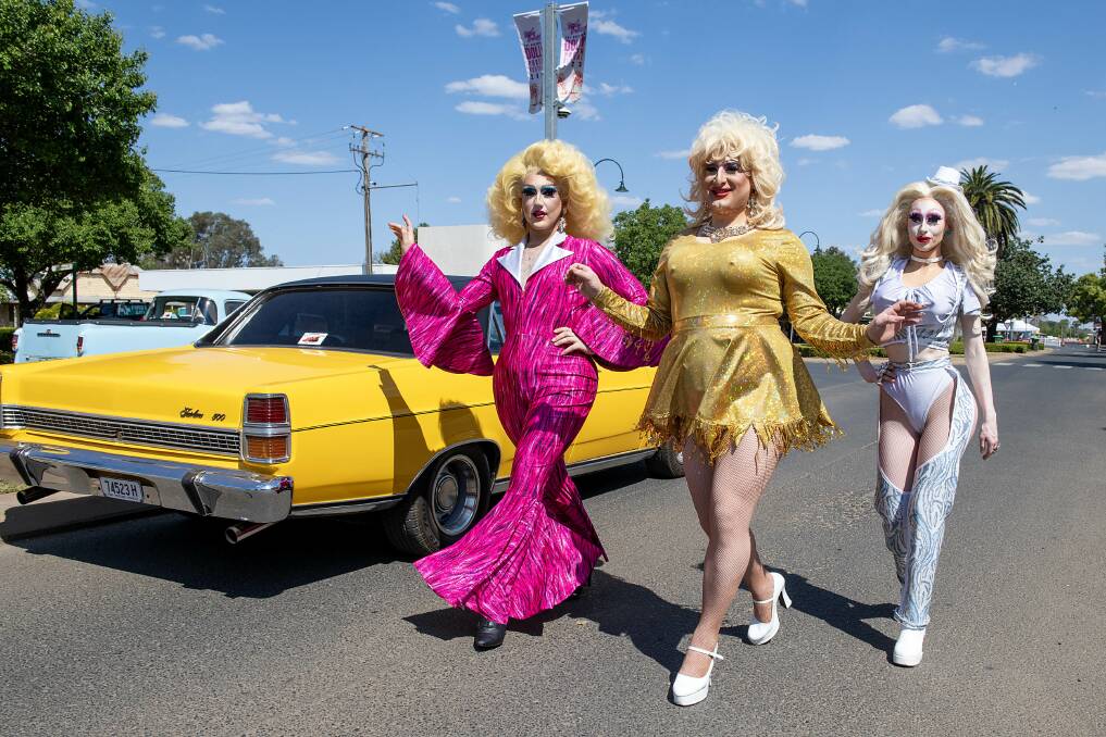 Drag queens Timberlina, Foxxe Faux and Abork strut down Dandaloo Street in Narromine at the 2023 Dolly Parton festival. Picture by Belinda Soole