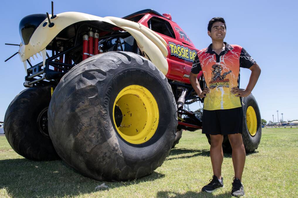 Cassius Stevenson standing in front of the 'Tassie Devil' monster truck. Picture by Belinda Soole 