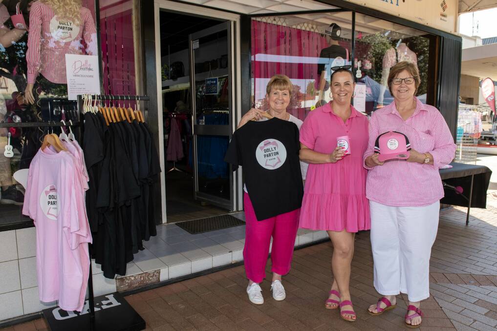 Nell and Crystal Paine with Deb Bock at Macquarie Clothing Narromine where you can pick up festival merchandise. Picture by Belinda Soole