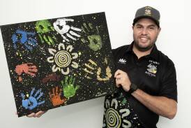 Dubbo Rhinos player Mitchell Williams with his designed print for the club's Indigenous jerseys. Picture by Belinda Soole