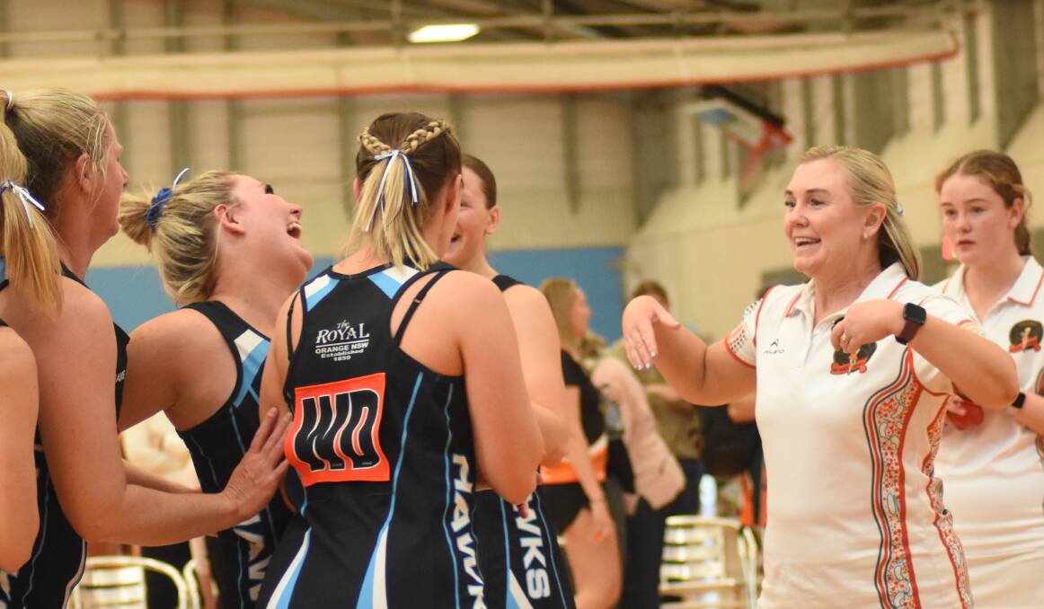 Hawks SMP Tiling share a laugh after their grand final victory. Picture by Riley Krause