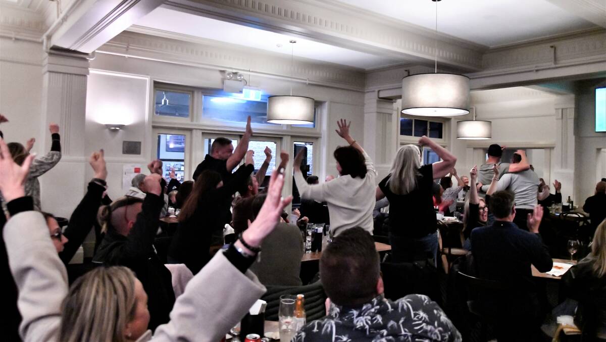 Waratah Sports Club erupts with delight as the Matildas make it through to the World Cup semi-final. Picture by Carla Freedman