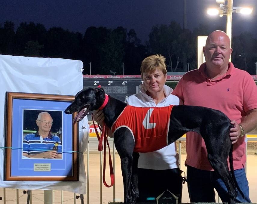 Charmaine Roberts and Shayne Stiff with Ruby Keeping after winning the Bryan Maxwell Memorial in 2021. The picture in the frame is of Bryan Maxwell. Picture supplied