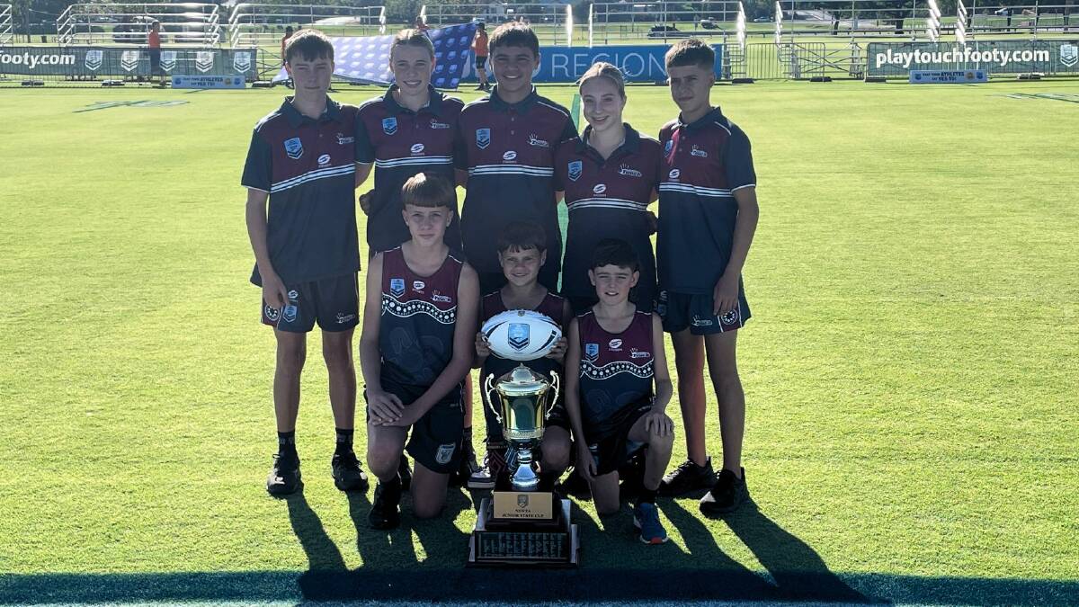 Dubbo Devils players with the Junior State Cup Northern Conference trophy prior to the 2024 carnival beginning. Picture by Nick Guthrie