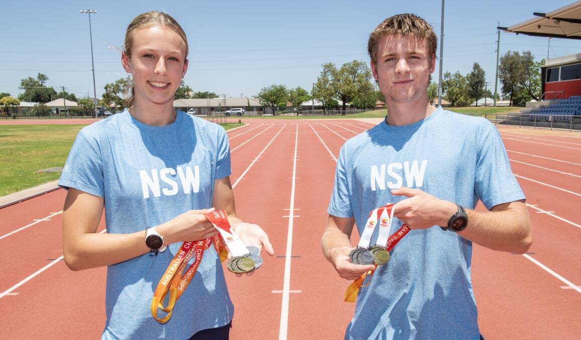 Ella Penman and Max McAneney with the medals they won at the Australian All Schools Athletics Championships. Picture by Belinda Soole