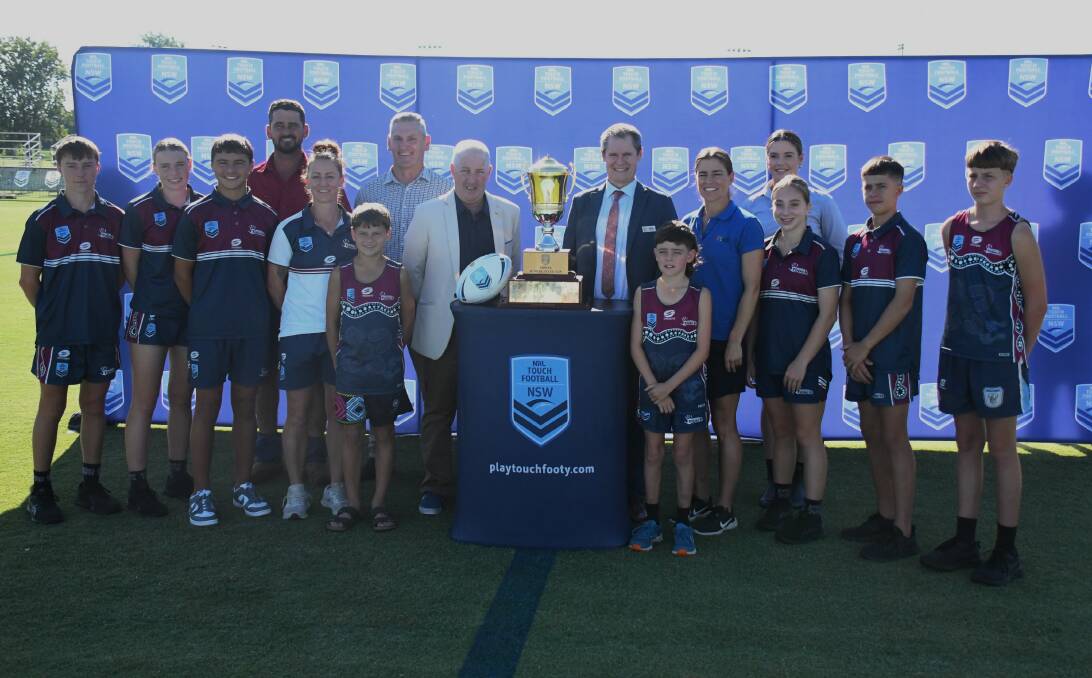 NSW Touch general manager and mayor Mathew Dickerson (centre) with State Cup sponsors and organisers and Dubbo junior players. Picture by Nick Guthrie