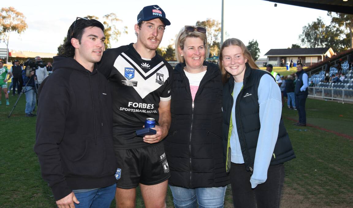Forbes star Mitch Andrews with members of the Scott (left) and Weir (right) families after Sunday's grand final. Picture by Amy McIntyre