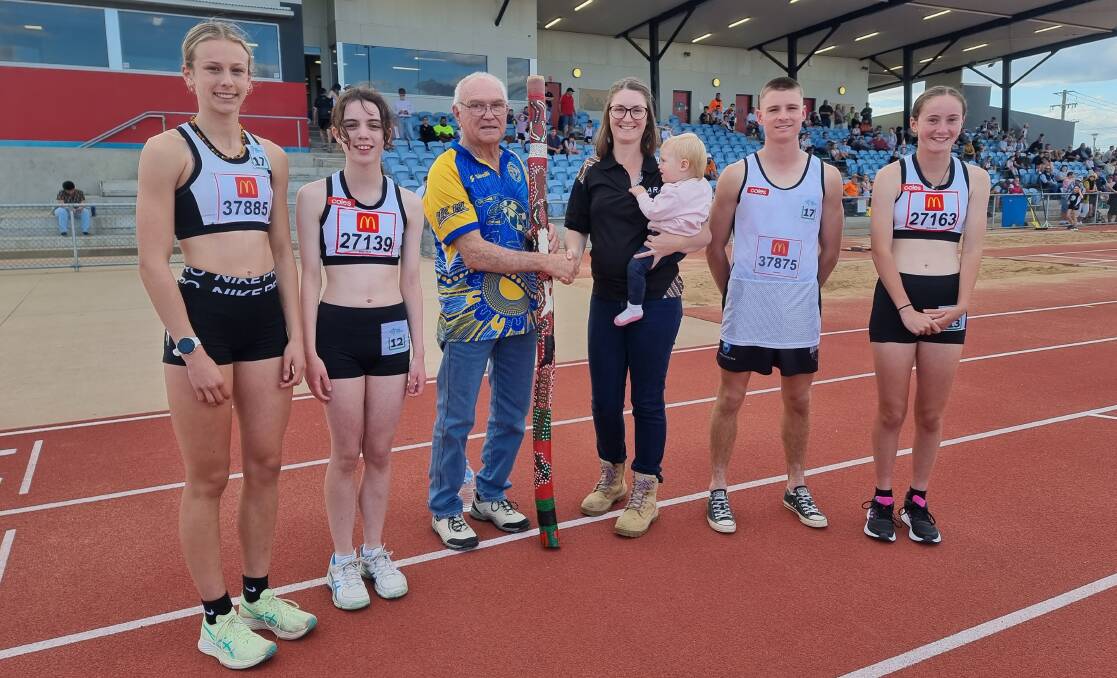 Phil Biles and Gemma Gumbleton from the ARTC with the donated didgeridoo (centre) along with nationals-bound athletes (from left) Ella Penman, Emily Lousick, Max McAnaney and Marli Pay. Absent: Lucy Turner. Picture supplied