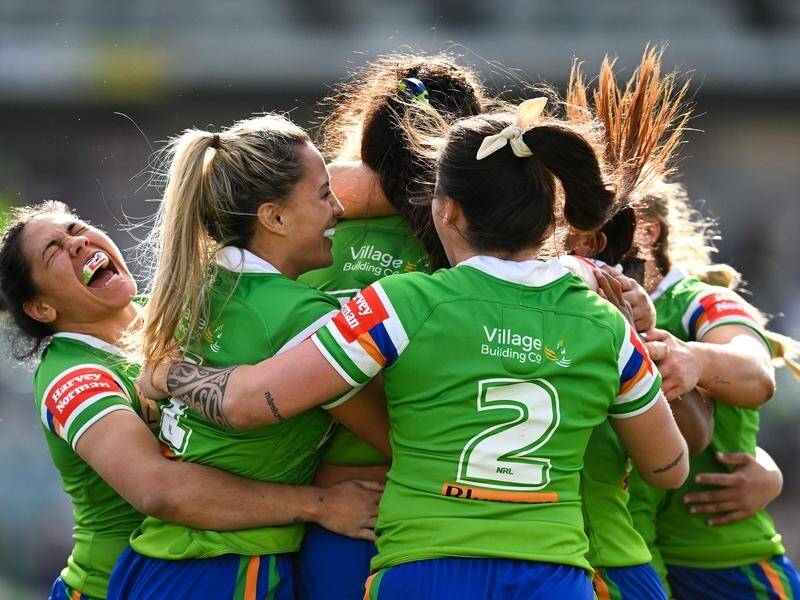 Canberra players celebrate a try in their surprise NRLW win over the Sydney Roosters. (Lukas Coch/AAP PHOTOS)