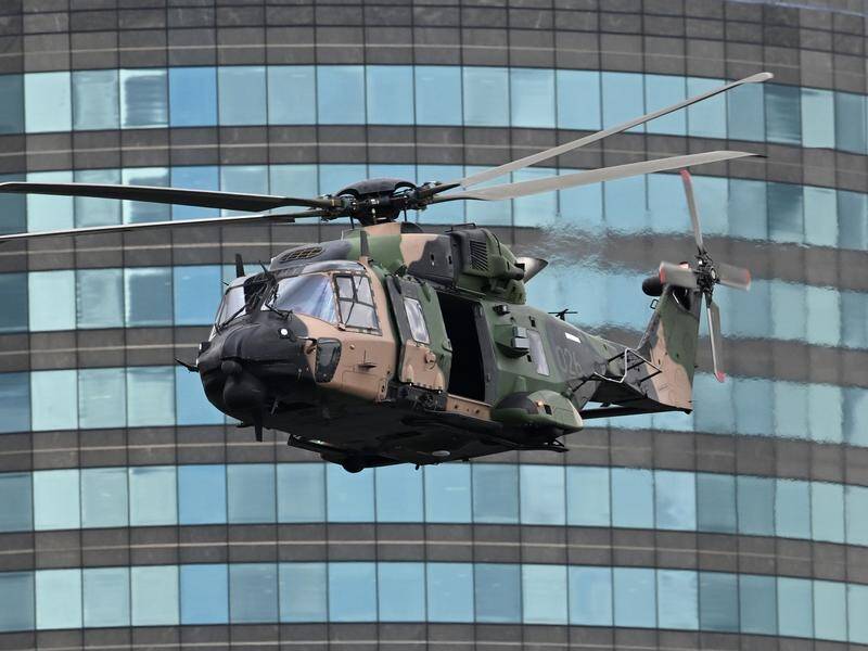 An Australian Army MRH-90 Taipan helicopter has gone down in Queensland and its crew are missing. (Darren England/AAP PHOTOS)