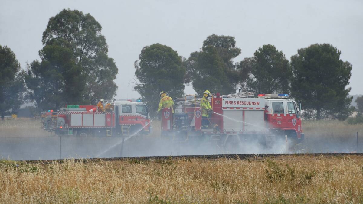 Fire and Rescue NSW and Orana RFS worked to extinguish fire that broke out on the Mitchell Highway. Photos: BELINDA SOOLE.